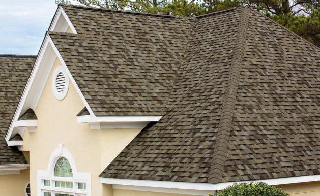 home with brown shingles